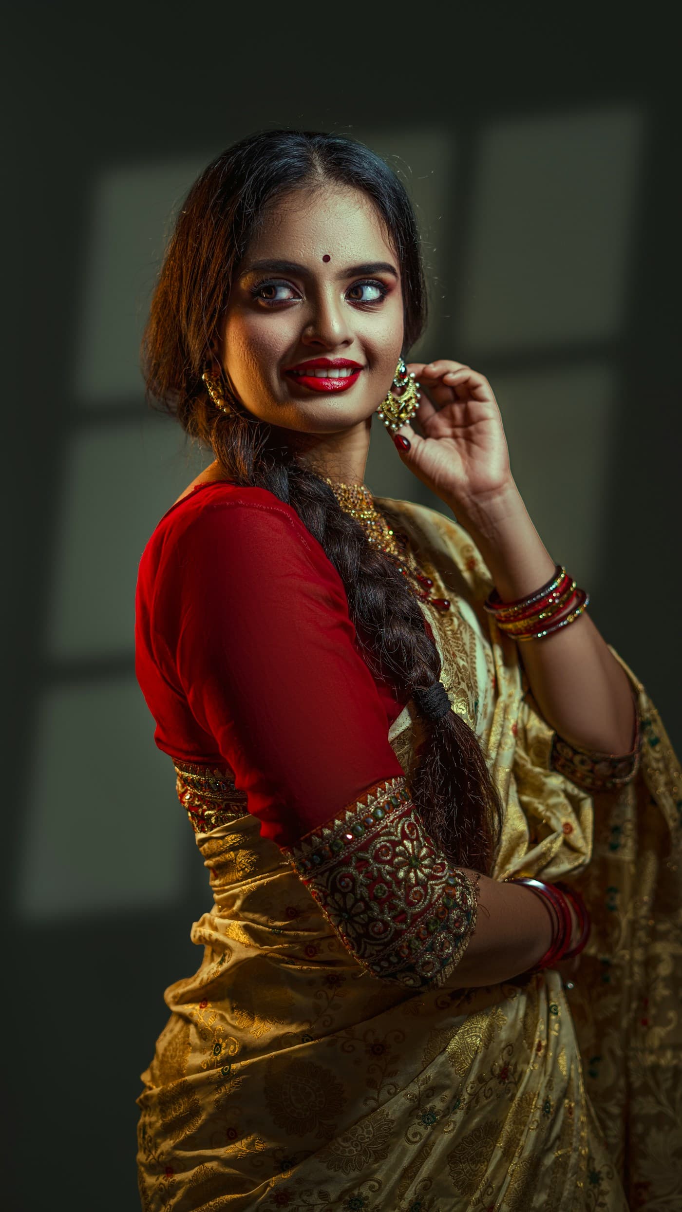 Indian portrait in a red and gold editorial look